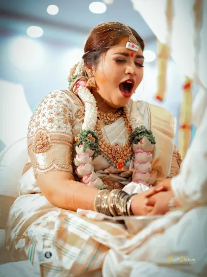 A candid moment of the bride yawning during the ceremony. It's the real, unscripted moments like these that add character to your wedding story.