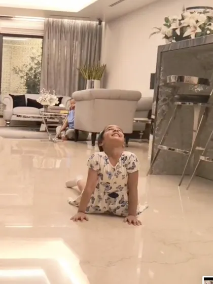 A young student masters the cobra pose, an essential asana for building back strength and improving posture.