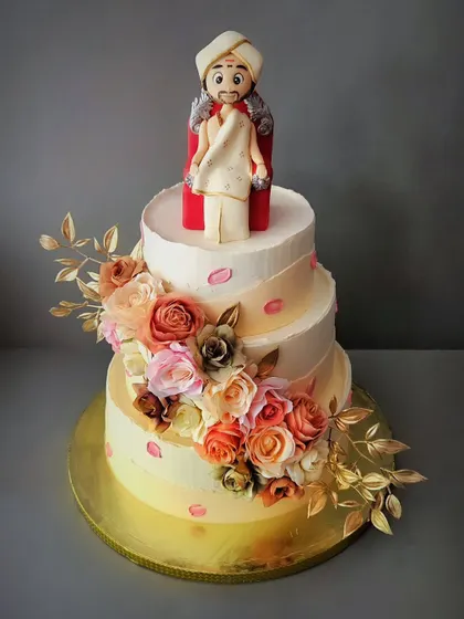 A grand 7kg chocolate truffle cake for Guruji's birthday. This three-tier floral cake was a special honor to make, complete with a custom-made figurine.