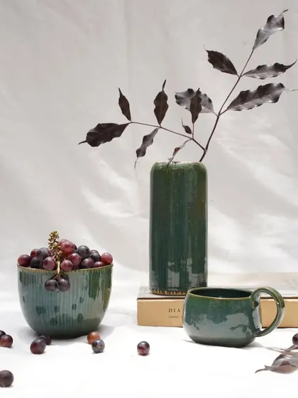 A collection of pieces finished with our Lush Green glaze. This versatile, stable glaze offers a rich forest green hue with subtle blue speckles, working beautifully on both light and dark stoneware clay bodies.