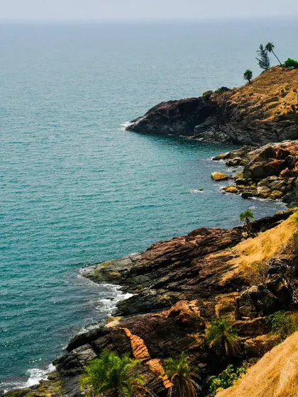The stunning rocky coastline of Gokarna, a view from one of the many coastal treks I lead. It's a perfect blend of hiking and beach scenery.
