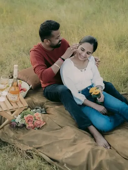 A tender moment during a countryside pre-wedding shoot, highlighting the couple's gentle connection.