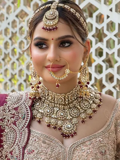 A happy, smiling portrait. The makeup is fresh and youthful, perfect for a modern bride.