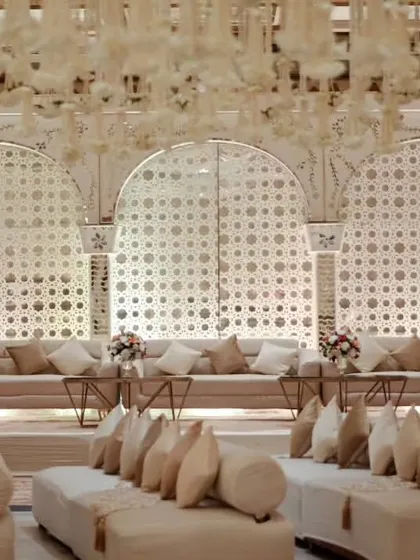 For a Sufi Night, we designed this 'Mastani Mahal' setup. It featured low floor seating with bolsters, intricate jaali backdrops, and a color palette of cream and gold to evoke royal, old-world charm.