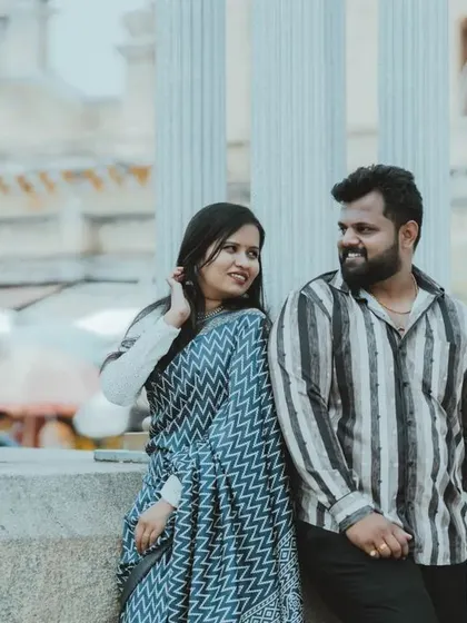 A candid moment of a couple sharing a look during their urban pre-wedding shoot. We capture the small interactions that show your love.