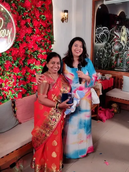 Posing with a happy guest after she won a prize in one of our games. Celebrating the winners is one of the best parts of my job.