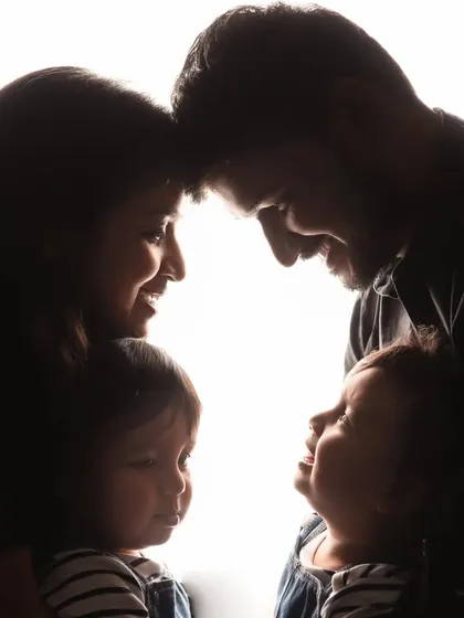 This silhouette shot is a beautiful and artistic way to capture the intimacy of your family. The focus is on the connection and love shared between parents and their children.