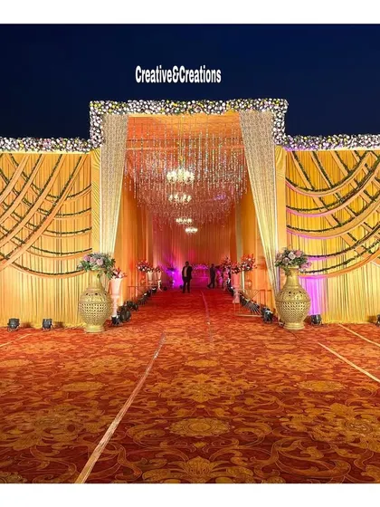 The full view of the grand yellow entrance, showcasing the scale and symmetry of the design. This type of entrance makes a powerful statement.