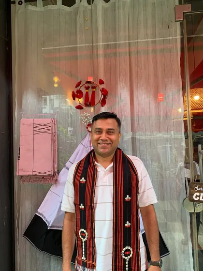 A guest proudly wearing a traditional Naga scarf during our Tuluni festival celebration. We love it when our guests embrace our culture.