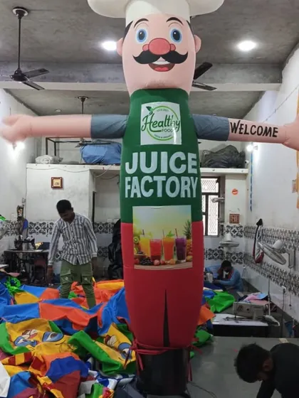 This chef-themed air dancer was created for a juice factory. Notice the detailed apron with the brand's logo and imagery, all printed in-house.