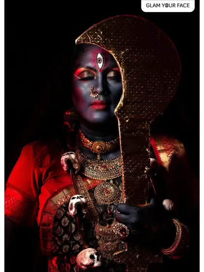 A contemplative moment from the Kali photoshoot, showing the artistry of the makeup even with closed eyes.