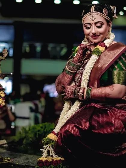 Candid moments from an Iyengar wedding. The bride's makeup is traditional and flawless, designed to last through all the smiles and rituals of the day.