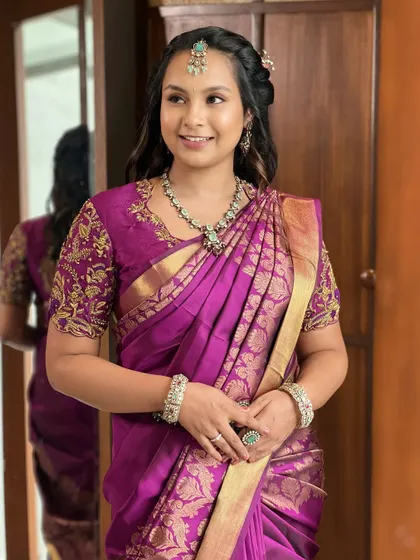 A smiling portrait of the bride, her natural beauty and elegant attire creating a picture of timeless grace.
