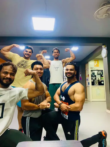 All smiles and flexes after a great session. We believe in working hard and having fun together. This is what our Fit Fam community is all about.