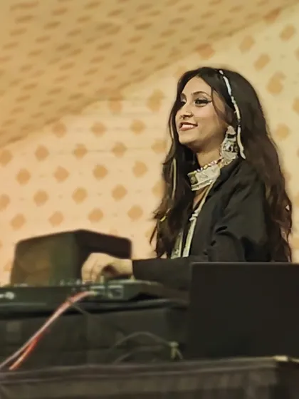 A moment of joy behind the decks. Seeing the crowd happy and dancing is the best part of my job as a professional Garba DJ.