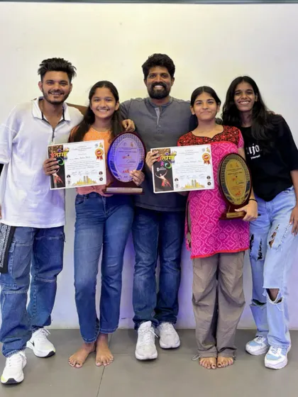 Celebrating our winners. Posing with students who have won trophies and certificates at various dance competitions.