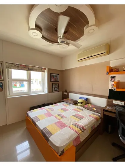 This view shows the compact study nook next to the bed, ensuring a dedicated space for homework and creative activities.