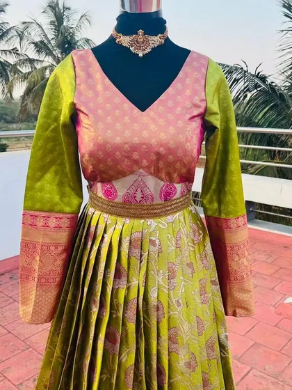 A close-up of the bodice, highlighting the unique design that mimics a blouse and belt.