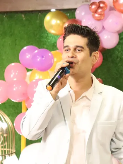 A clear shot of me hosting, with the colorful birthday party decor creating a festive backdrop.