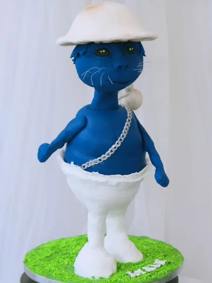 A fully sculpted, 3D version of the viral Blue Smurf Cat character. This structural cake is a true work of art, perfect for someone who wants a cake that is completely out of the ordinary.