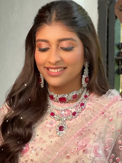 A close-up to show the delicate, shimmery eye makeup and the natural, dewy skin finish. This look is romantic, beautiful, and lets the bride's features shine.