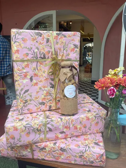 My design philosophy is about creating things that work beautifully. Here, I've stacked gifts wrapped in elegant floral paper, showing how even simple wrapping can make a big impact.