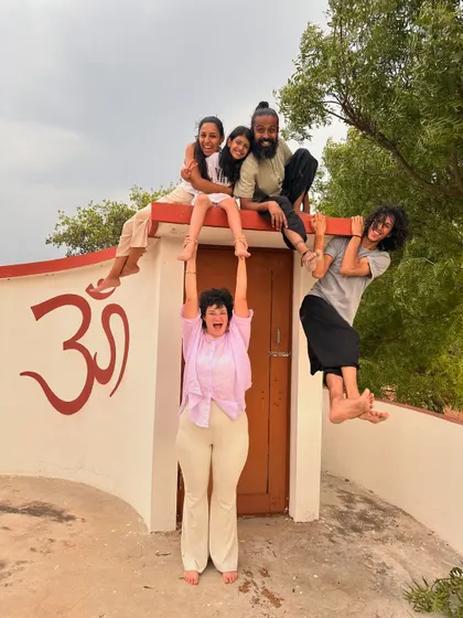A playful moment of acrobatics on the ashram roof. We believe that spiritual life should be filled with laughter, creativity, and a sense of fun.