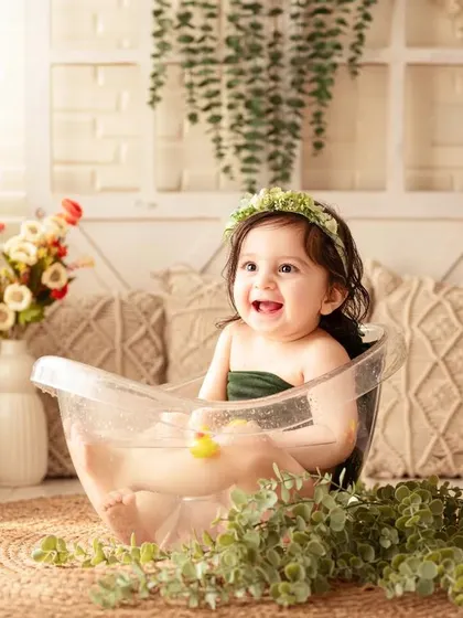 A post-cake smash bubble bath is the perfect way to end a first birthday shoot, full of smiles and splashes.