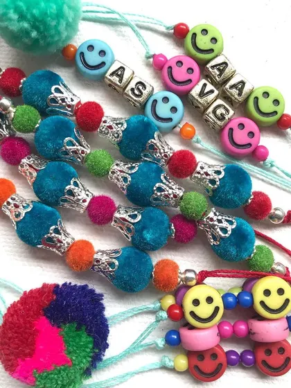 This is what pure joy looks like. I create these colourful, personalised rakhis and friendship bands with a mix of fun beads, smiley faces, and custom name blocks, making them a cheerful gift for anyone.