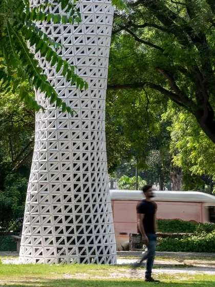 The tower's name, VERTO, is derived from the word "turn," reflecting its rotating geometry. The performance-driven perforation pattern features larger openings at air intake and outlet zones, which also accentuates the helical design.