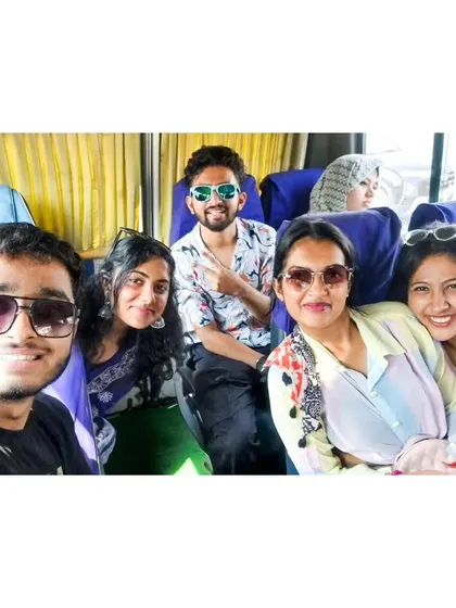 A selfie on the bus during our Mysore trip. The journey is always full of smiles and good company.
