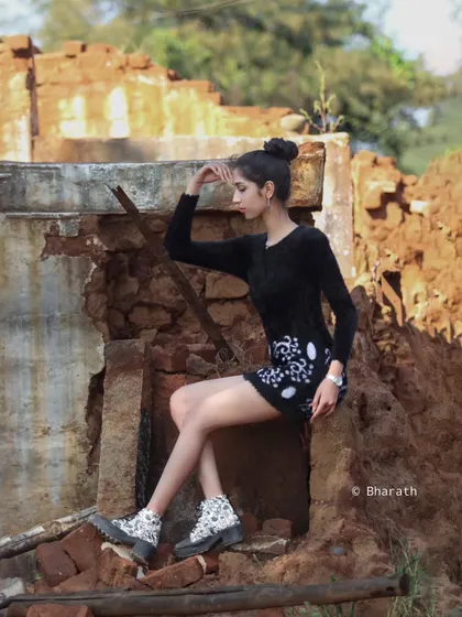 This shot captures a moment of reflection, using the unique environment of an old structure to tell a story.