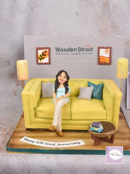 The full view of the sofa cake, showing the entire edible room setup.