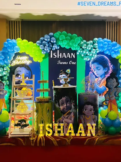 Celebrating a first birthday with a Little Krishna theme is always special. I designed this entire stage with custom backdrops, character cutouts, themed props like a pot of butter, and a blue and green balloon arch to complete the divine look.