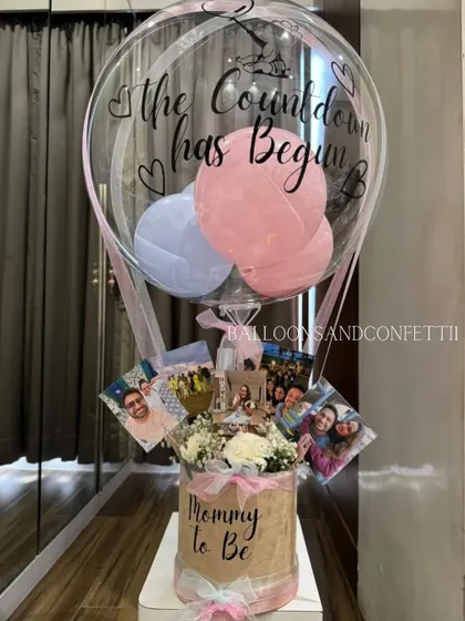 The countdown has begun! This "Mommy to Be" hot air balloon hamper is a thoughtful baby shower gift, personalized with photos and filled with goodies to pamper the new mom.