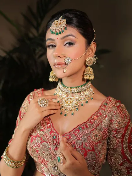 A close-up portrait of a stunning guest. The intricate nose ring and jewellery are perfectly complemented by the soft glam makeup.