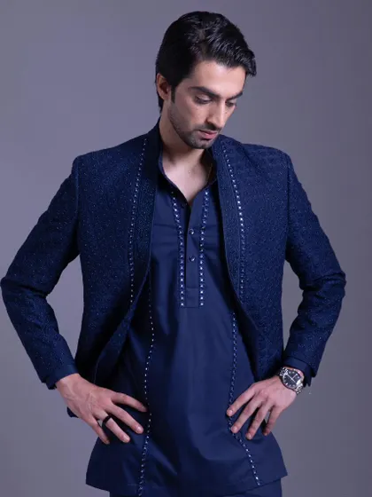 Celebrate in style with this vibrant blue Indo-Western set. The intricate embroidery and luxurious details make it a stunning choice for any festive collection.