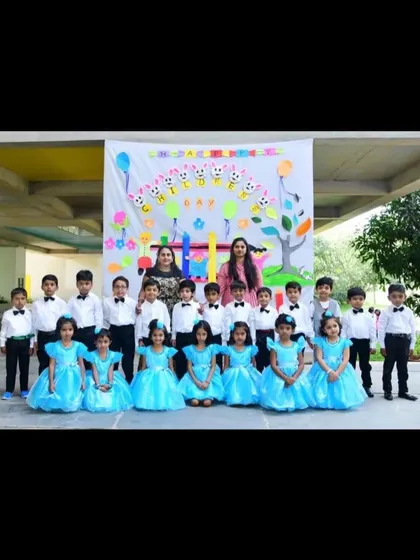 This group from Brigade School is ready for their performance in matching sky-blue dresses and coordinated outfits for the boys.
