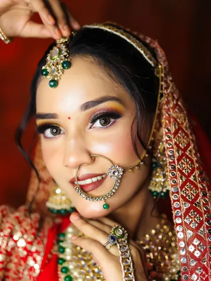 This shot highlights the importance of a confident smile, enhanced by perfectly applied lipstick and a radiant complexion. We teach techniques for long-lasting lip color.