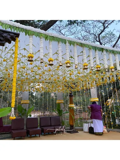 The final touches being put on the mandap before the ceremony begins. This image captures the careful craftsmanship and attention to detail that goes into every wedding I design.