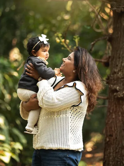 There's something magical about shooting outdoors in natural light. This sweet moment between a mother and her baby girl is filled with the warmth and beauty of nature.