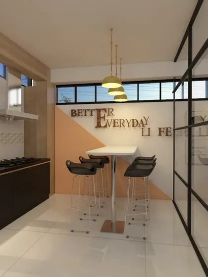 A view of the office pantry, designed with a clean and modern aesthetic. The space includes a functional kitchenette and a small dining area, separated from the main workspace by a sleek glass partition.