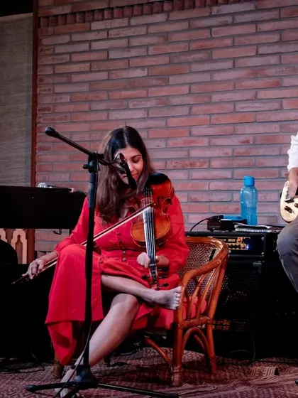 A performance shot of REFUGE, a contemporary jazz group featuring violin, piano, and fretless bass. This shows how our stage setup can be adapted for different band configurations and musical styles.