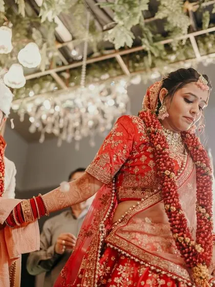 The couple walks together during their wedding ceremony, a candid moment captured from a low angle.