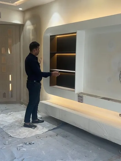 The TV unit is almost complete. I'm making sure every shelf and light is perfect before the final cleanup.