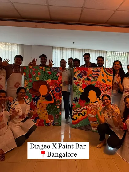 The Diageo team in Bangalore showing off their two completed collaborative canvases. It was a day of color, creativity, and connection, resulting in artwork that truly represents their collective spirit.