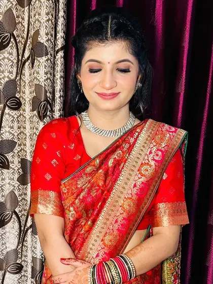 A close-up of the bride's makeup, showing the flawless finish and soft eye makeup.