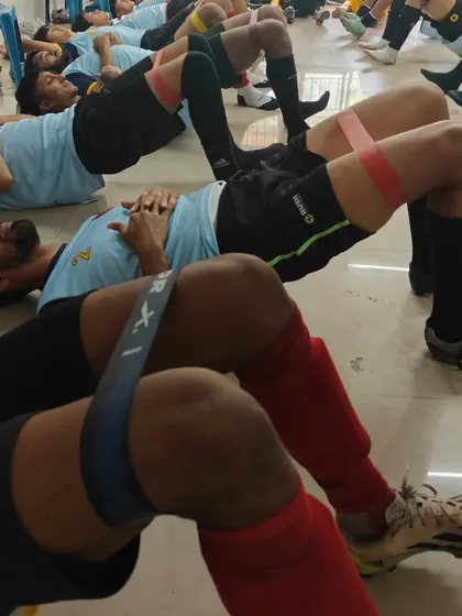 A close-up of our players during a strength and conditioning session. We focus on functional movements that translate directly to improved performance and resilience on the pitch.