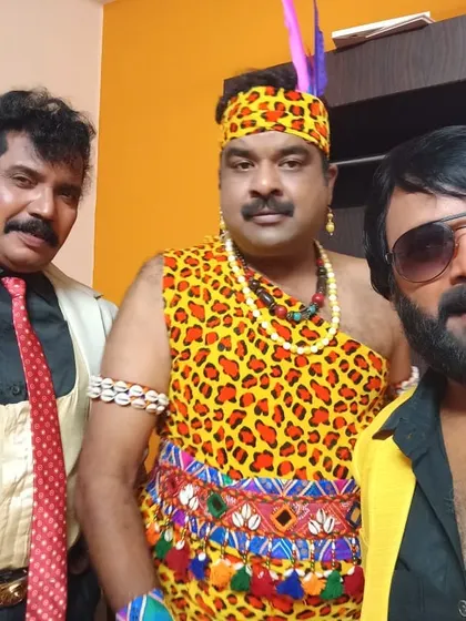 In a tribal costume with co-actors during a DKD shoot.