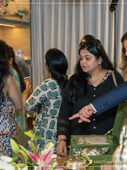 My team guiding guests through the collections at the Ahmedabad store opening, explaining the story and inspiration behind each hamper.